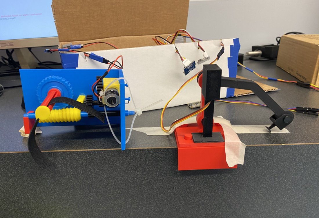 Close-up of the 3D-printed gear mechanism in the seatbelt-tugging assembly